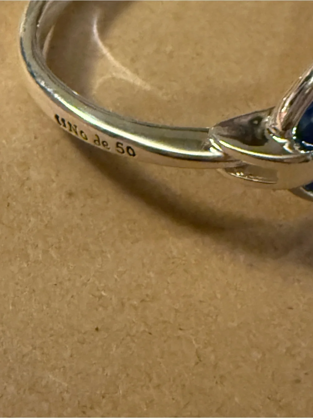 Uno de 50 bangle bracelet with faceted blue crystal